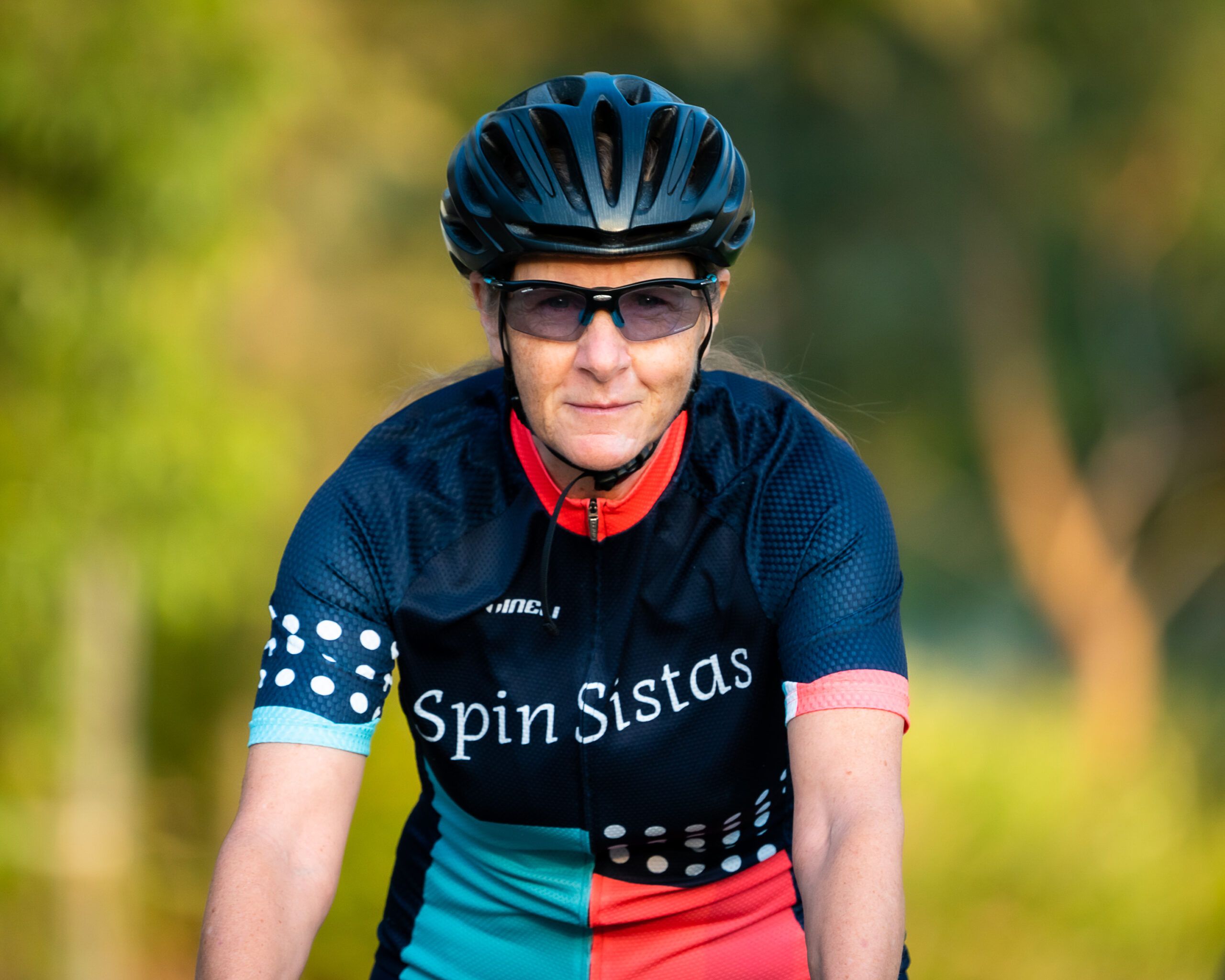 Portrait of a Spin Sistas cyclist wearing the team kit